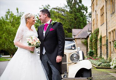 Married portrait beside the wedding car