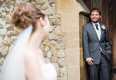 bride looking lovingly at groom photo