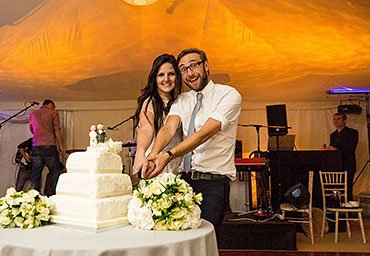 wedding cake cutting at the reception party